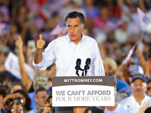 Republican Presidential candidate and former Massachusetts Governor Mitt Romney gestures as he speaks to supporters during a campaign rally in St. Petersburg, Florida. (AP Photo/Chris O'Meara)