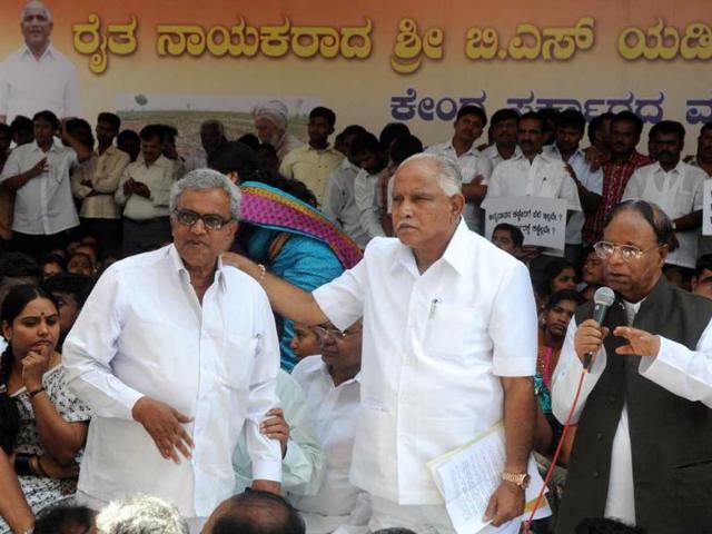 Former Karnataka chief minister BS Yeddyurappa and his supporters protest on the Cauvery water issue at Mahatma Gandhi statue near Anand Rao Circle in Bangalore. UNI