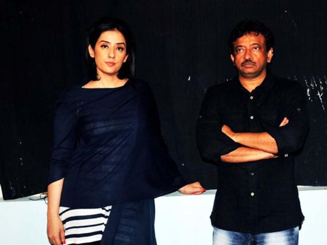Manisha Koirala (L) and RGV strike a pose for shutterbugs. (AFP)