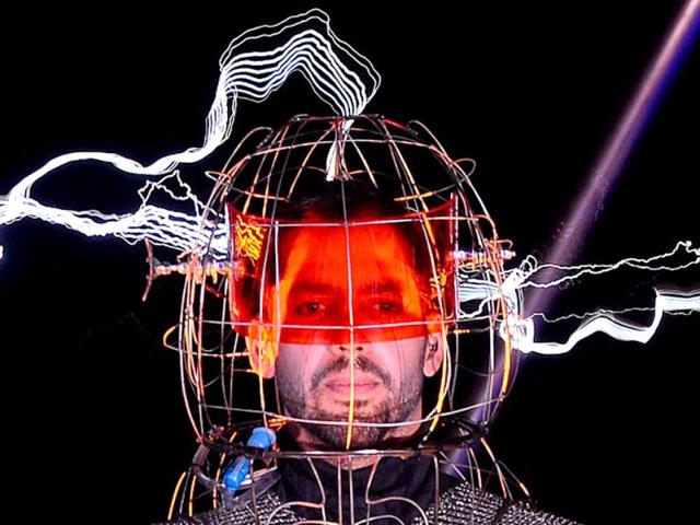 US magician David Blaine stands under lighting bolts at the start of his latest performance, "Electrified", in New York. AFP /Emmanuel Dunand