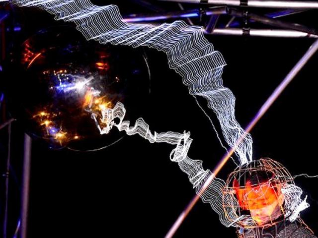 US magician David Blaine stands under lighting bolts at the start of his latest performance, "Electrified", in New York. AFP /Emmanuel Dunand