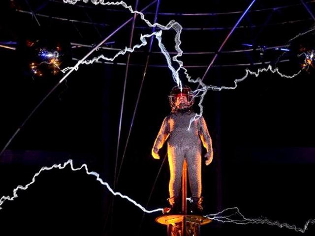 US magician David Blaine stands under lighting bolts at the start of his latest performance, "Electrified", in New York. AFP /Emmanuel Dunand