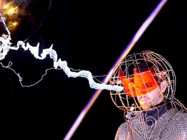 US magician David Blaine stands under lighting bolts at the start of his latest performance, "Electrified", in New York. AFP /Emmanuel Dunand