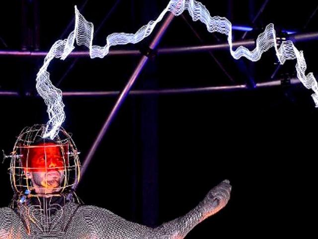 US magician David Blaine stands under lighting bolts at the start of his latest performance, "Electrified", in New York. AFP /Emmanuel Dunand