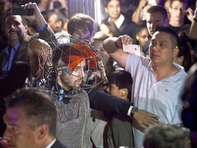 Magician David Blaine walks through the crowd prior to a stunt involving channeling bolts of electricity from various tesla coils charged with one million volts of electricity on Pier 54 in New York. Reuters/Andrew Burton