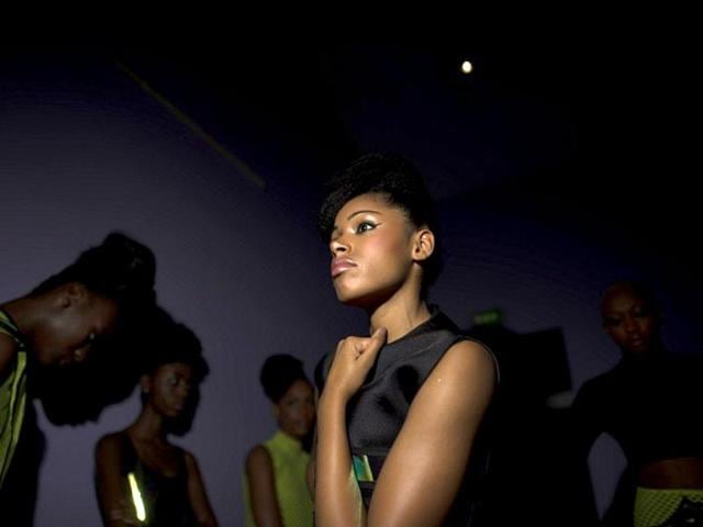 Models wearing Adama Paris creation wait in the backstage before the Black Fashion Week show in Paris. AFP photo