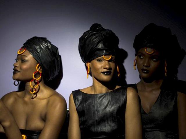 Models wearing Adama Paris creation wait in the backstage before the Black Fashion Week show in Paris. AFP photo