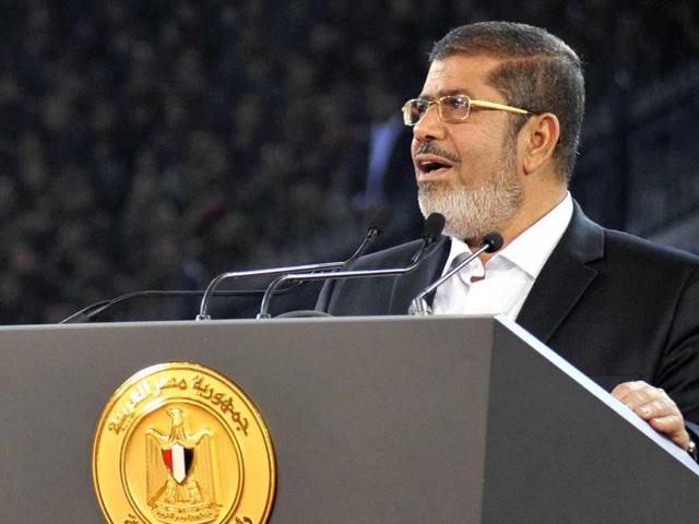 Egypt's President Mohammed Mursi speaks to the nation at Cairo stadium to mark the anniversary of Egypt's successful crossing of the Suez Canal in its October 1973 war against Israel. Reuters/Egyptian Presidency/Handout