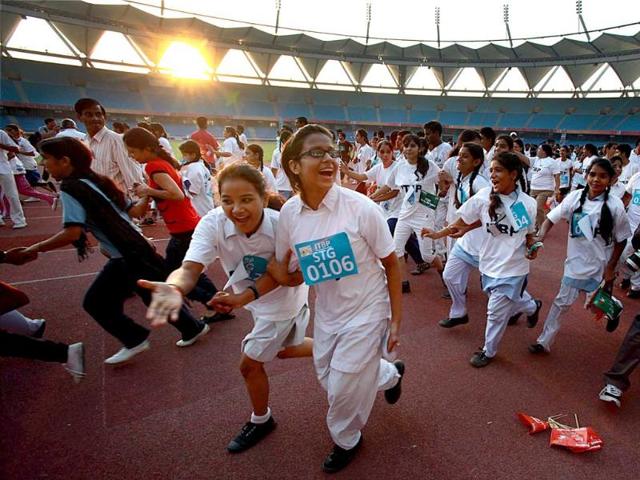 Students take part in an ITBP half marathon at Jawharlal Nehru Stadium in New Delhi. (PTI Photo/Shahbaz Khan)