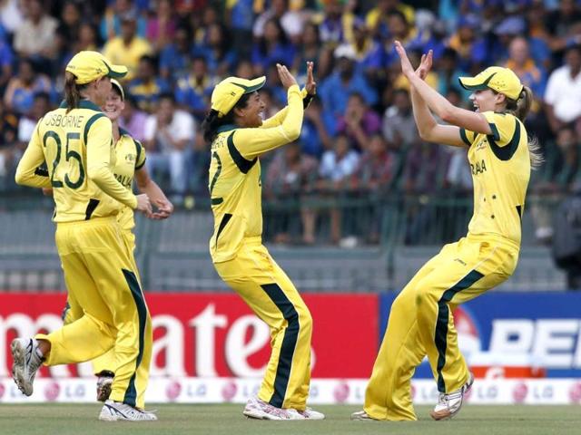 Australia's Lisa Sthalekar, Ellyse Perry, and Erin Osborne celebrate the dismissal of England's batsman Charlotte Edwards, unseen, during their ICC Women's Twenty20 Cricket World Cup final match in Colombo, Sri Lanka. AP/Gemunu Amarasinghe