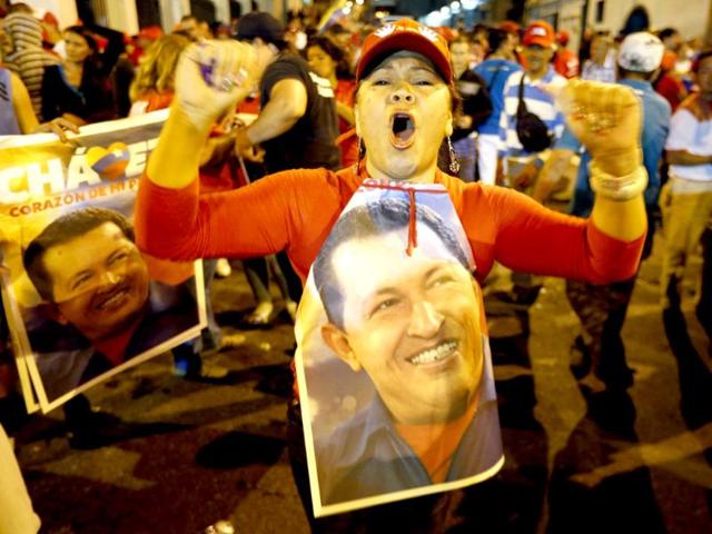 Supporters of Venezuelan president Hugo Chavez gather outside Miraflores Palace to wait for the results of Presidential elections in Caracas. Reuters/Jorge Silva