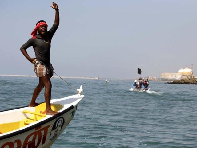 A fisherman stands on a boat and shouts slogans during a protest against the Kudankulam Atomic Power Project at Kudankulam in Tamil Nadu. AP Photo