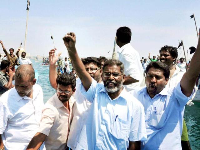 Anti-KNPP protesters and fishermen, on board boats, shout slogans as they try to lay siege to the Kudankulam Nuclear Power Plant at Kudankulam. PTI Photo