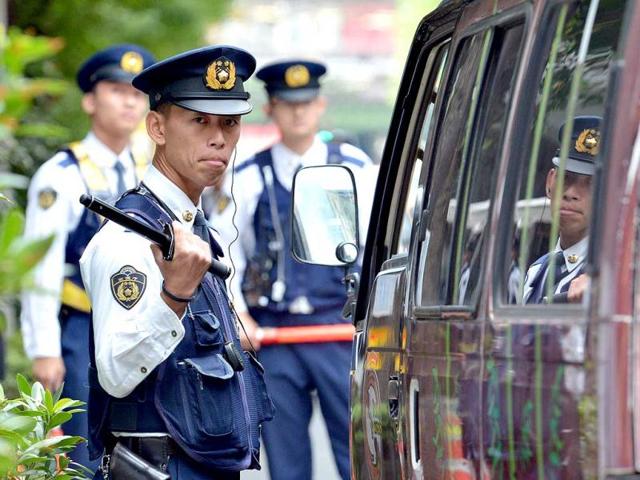 A policeman checks a van at a checkpoint near the venue of the International Monetary Fund (IMF) and World Bank Group annual meeting in Tokyo. Some 20,000 government and institution officials, including IMF chief Christine Lagarde, will gather for the IMF and the World Bank Group annual meetings in Tokyo from October 9 to 14. AFP PHOTO / Yoshikazu TSUNO