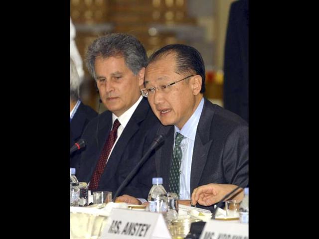 The World Bank Group President Jim Yong Kim, right, delivers a speech before Japanese lawmakers at a breakfast meeting at a Tokyo hotel. AP/Yoshikazu Tsuno, Pool