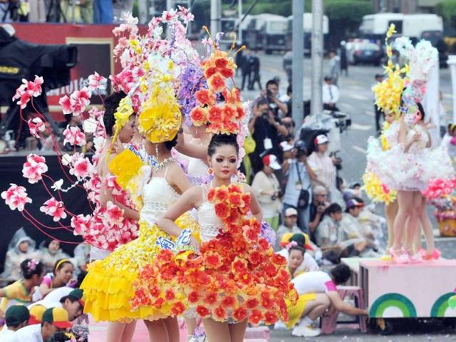 Students perform during celebrations to mark the centenary of the revolution that set the stage for the Republic of China, island's official name, in front of Taiwan's Presidential Office in Taipei. AFP Photo/Mandy Cheng