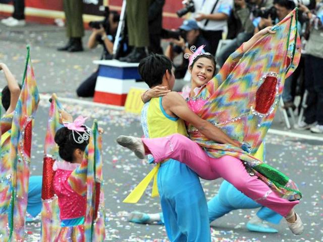 Students perform during celebrations to mark the centenary of the revolution that set the stage for the Republic of China, island's official name, in front of Taiwan's Presidential Office in Taipei. AFP Photo/Mandy Cheng