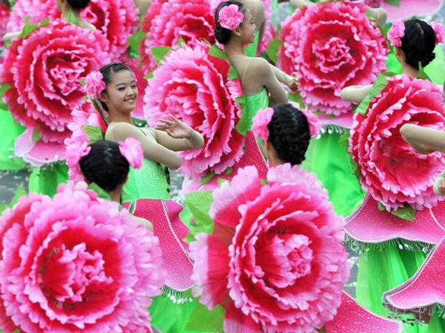 Students perform during celebrations to mark the centenary of the revolution that set the stage for the Republic of China, island's official name, in front of Taiwan's Presidential Office in Taipei. AFP Photo/Mandy Cheng