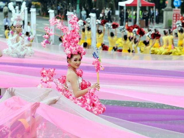 Students perform during celebrations to mark the centenary of the revolution that set the stage for the Republic of China, island's official name, in front of Taiwan's Presidential Office in Taipei. AFP Photo/Mandy Cheng