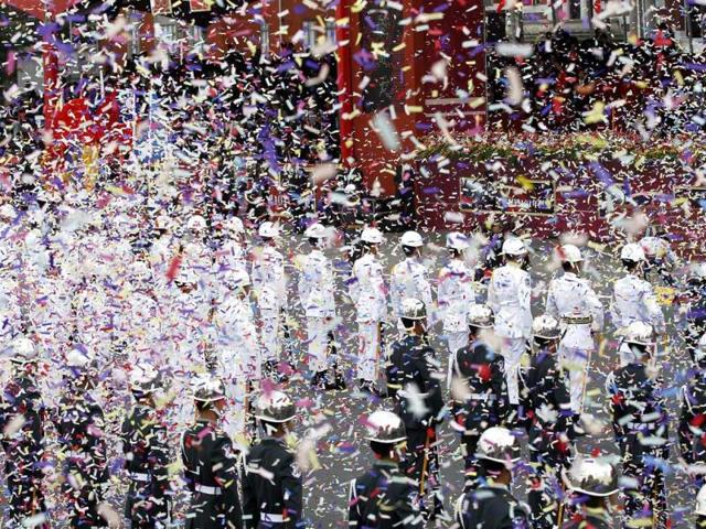 Members of the military honour guard take part in Taiwan's National Day celebrations as confetti is set off, in front of the Presidential Office in Taipei. Reuters/Pichi Chuang