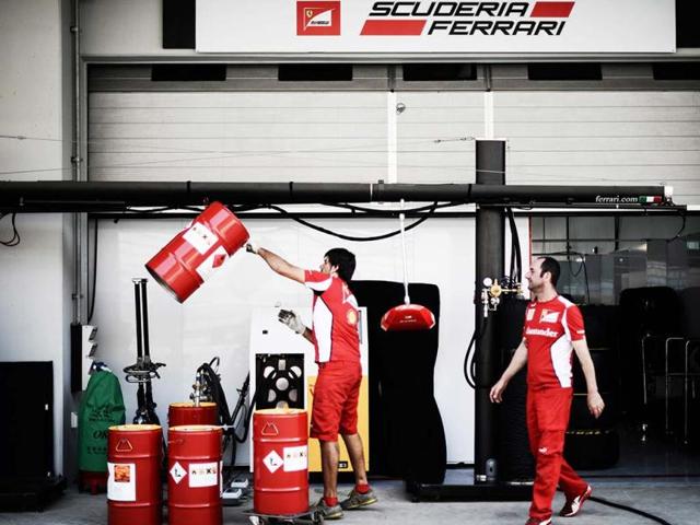 Ferrari team members are seen in the pit lane of the circuit for the Formula One Korean Grand Prix in Yeongam. AFP photo