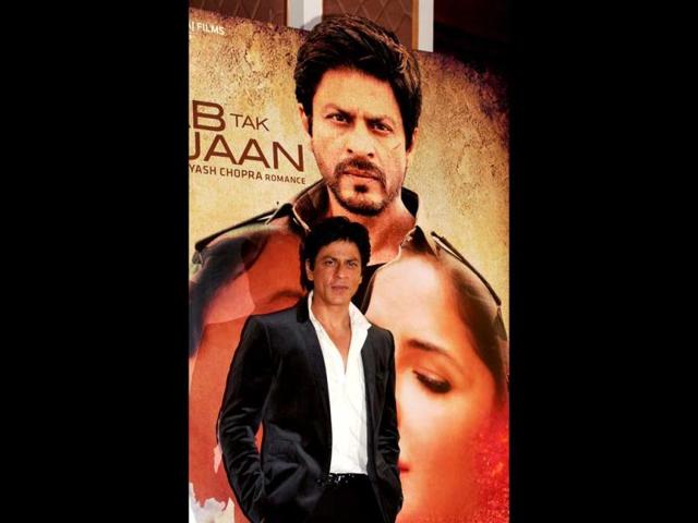 Picture perfect: SRK poses in front of his JTHJ poster at the promotional event.