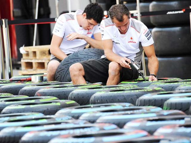 Members of the McLaren Mercedes team check tyres ahead of the Formula One Korean Grand Prix in Yeongam. AFP photo