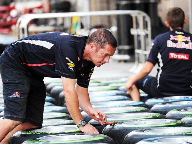Members of the Red Bull technical team prepare tyres ahead of the Formula One Korean Grand Prix in Yeongam. AFP photo