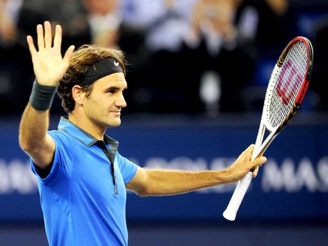Roger Federer of Switzerland celebrates beating Yen-Hsun Lu of Taiwan in their second round match of the Shanghai Masters tennis tournament in Shanghai. AFP/Peter Parks