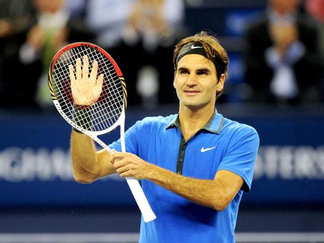 Roger Federer of Switzerland celebrates beating Yen-Hsun Lu of Taiwan in their second round match of the Shanghai Masters tennis tournament in Shanghai. AFP/Peter Parks