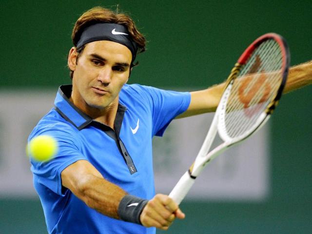 Roger Federer of Switzerland hits a return to Yen-Hsun Lu of Taiwan in their second round match of the Shanghai Masters tennis tournament in Shanghai. AFP/Peter Parks
