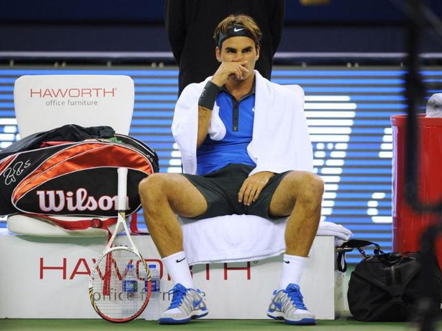 Roger Federer of Switzerland takes a break during his match against Yen-Hsun Lu of Taiwan in the second round of the Shanghai Masters tennis tournament in Shanghai. AFP/Peter Parks