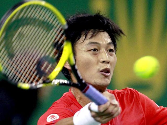 Taiwan's Yen-Hsun Lu hits a return during his single's tennis match against Switzerland's Roger Federer at the Shanghai Masters tournament in Shanghai. Reuters/Aly Song