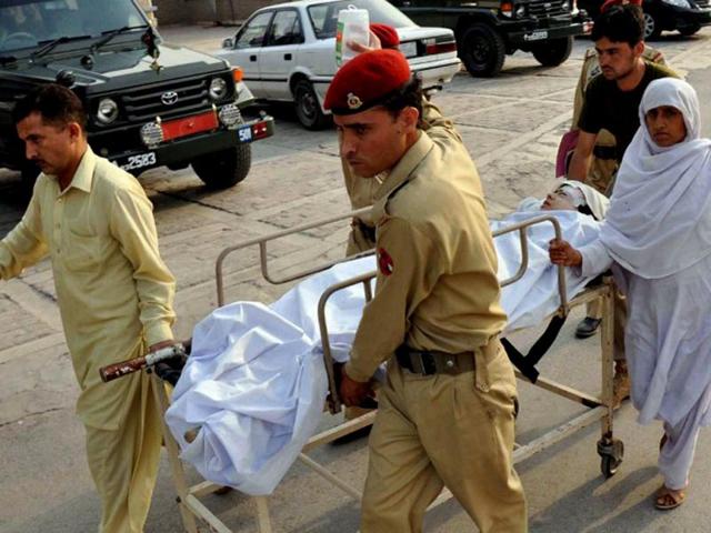Pakistani soldiers carry injured Malala Yousafzai, 14, at an army hospital following an attack by gunmen in Peshawar. The teenage Pakistani children's rights activist was shot in the head in an assassination attempt as she boarded a school bus in the former Taliban stronghold of Swat, officials said. AFP