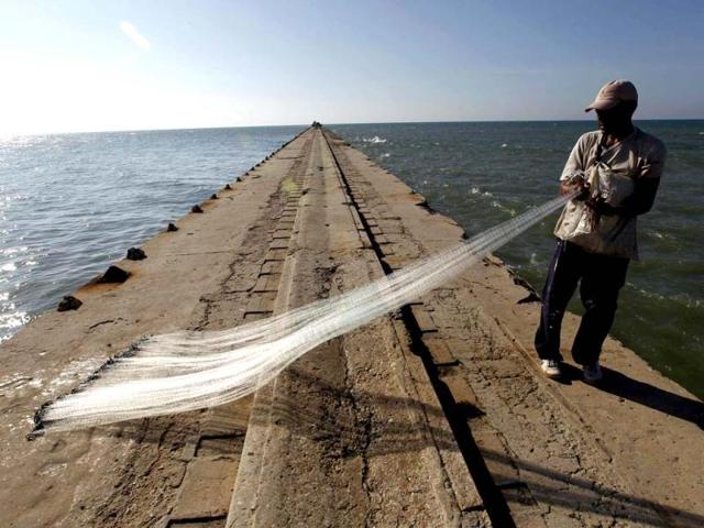 A fisherman prepares his net on a deteriorated pier in Puerto Colombia. This pier was built in 1888 and was used until 1936 as a sea terminal for passengers and cargo heading to and from Barranquilla city. At the time that Puerto Colombia was a major seaport, this was for a while the third longest pier in the world. However, now the pier has become a dilapidated relic. Reuters Photo