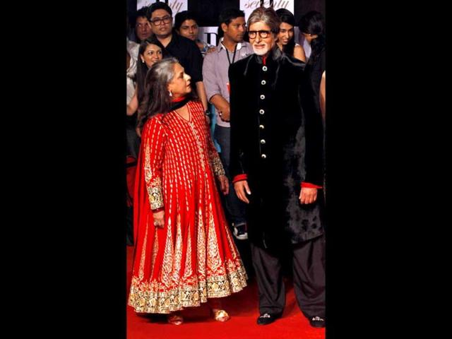 Jaya Bachchan in a bright anarkali poses with hubby Amitabh Bachchan, who is seen in a black velvet sherwani.