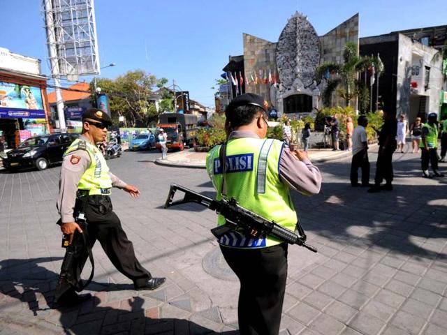 Indonesia police patrol the area during security preparations around the memorial monument for the 2002 Bali bombing victims in the Kuta tourist area near Denpasar on the Indonesian resort island of Bali. AFP Photo