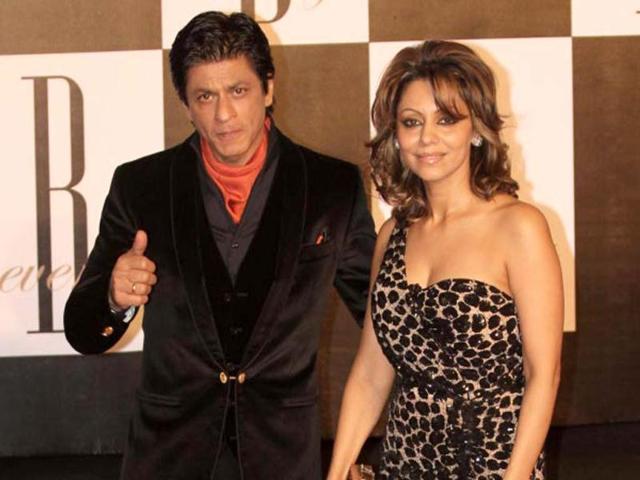 Superstar Shah Rukh Khan with wife Gauri poses as he arrives.