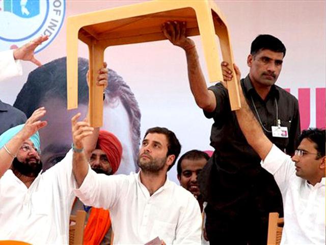 -Congress-General-Secretary-Rahul-Gandhi-removes-a-table-which-was-placed-in-front-of-him-during-a-NSUI-function-in-Chandigarh-AP-Photo