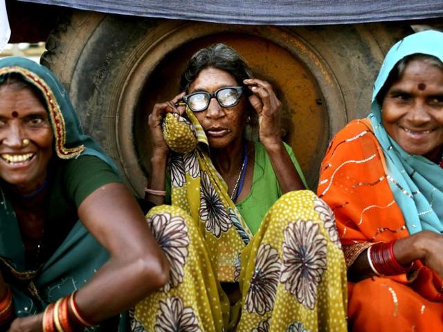 Landless farmers rest before starting the day's march during the "Jan Satyagraha," near Agra. AP/Kevin Frayer