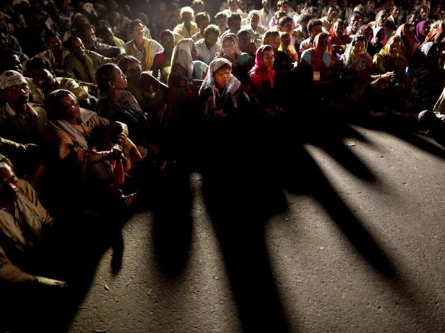 Landless farmers gather for an entertainment programme as they halt for the night, during the "Jan Satyagraha" march to New Delhi to highlight the problems of India's landless, near Agra. AP/Kevin Frayer