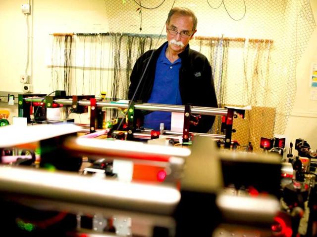 David J Wineland, a physicist at the US Department of Commerce's National Institute of Standards and Technology (NIST), gives media a tour of his lab after winning the 2012 Nobel Prize in Physics for "ground-breaking experimental methods that enable measuring and manipulation of individual quantum systems." AFP/Dana Romanoff