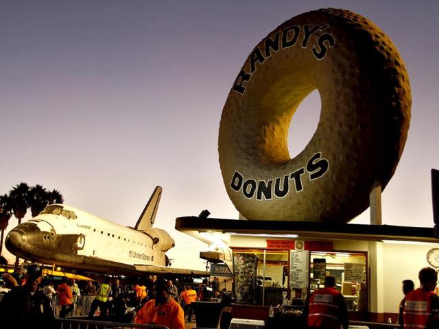 Space Shuttle Endeavour stops in front of Randy's Donuts as it's transported on Manchester Avenue while being moved from Los Angeles International Airport to its retirement home at the California Science Center in Exposition Park in Los Angeles, California. Reuters photo