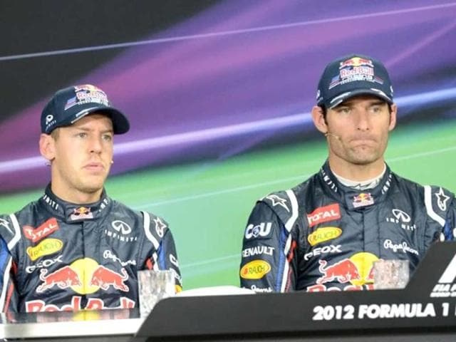 Pole sitter Red Bull-Renault driver Mark Webber of Australia and second-placed Red Bull-Renault driver Sebastian Vettel of Germany attend a press conference after the qualifying session of the Formula One Korean Grand Prix in Yeongam. AFP / Roslan Rahman