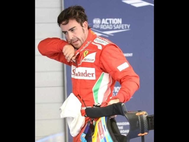 Ferrari driver Fernando Alonso of Spain is seen after finishing fourth in the qualifying session of the Formula One Korean Grand Prix in Yeongam. / Roslan Rahman