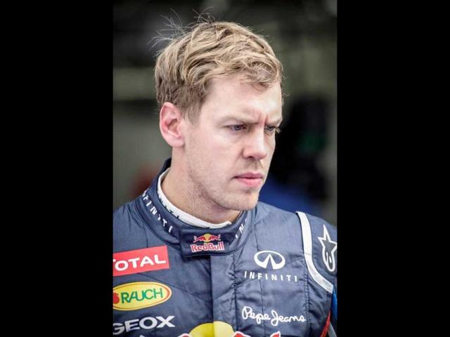 Red Bull-Renault driver Sebastian Vettel of Germany looks on after finished second in the qualifying session of the Formula One Korean Grand Prix in Yeongam on October 13, 2012. AFP PHOTO / Philippe Lopez