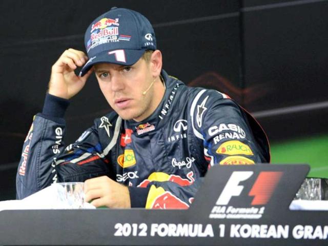 Red Bull-Renault driver Sebastian Vettel of Germany listens to a question during a press conference after finishing second in the qualifying session of the Formula One Korean Grand Prix in Yeongam. AFP / Roslan Rahman