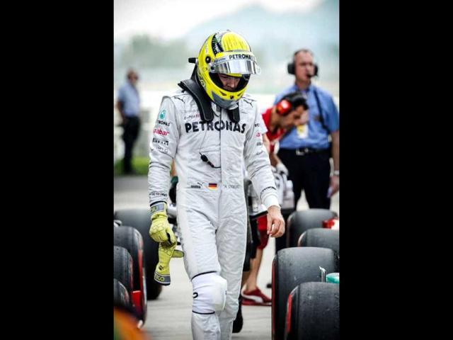 Mercedes-AMG driver Nico Rosberg of Germany looks down after finishing ninth in the qualifying session of the Formula One Korean Grand Prix in Yeongam. AFP / Philippe Lopez