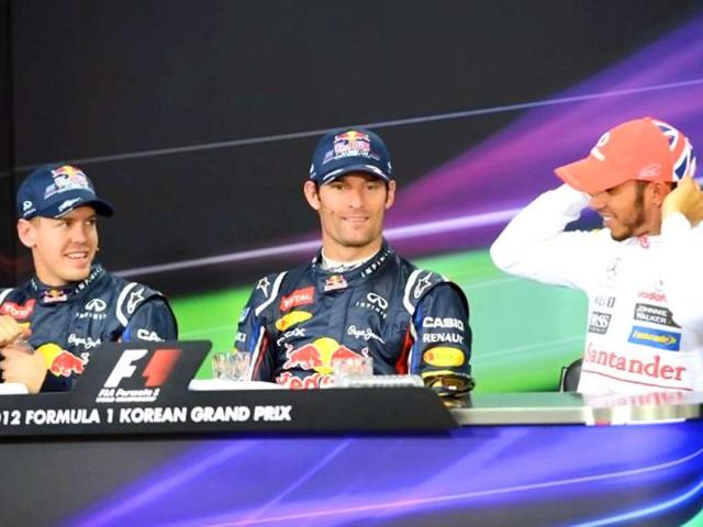 Pole sitter Red Bull-Renault driver Mark Webber of Australia, second-placed Red Bull-Renault driver Sebastian Vettel of Germany and third-placed McLaren-Mercedes driver Lewis Hamilton of Britain attend a press conference after the qualifying session of the Formula One Korean Grand Prix in Yeongam. AFP / Roslan Rahman
