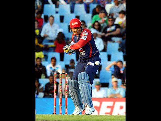 Delhi Daredevils Virender Sehwag plays a shot from Kolkata Knight Riders Brett Lee during a Group A match of the Champions League T20 at Super Sports Park in Centurion. AFP Photo